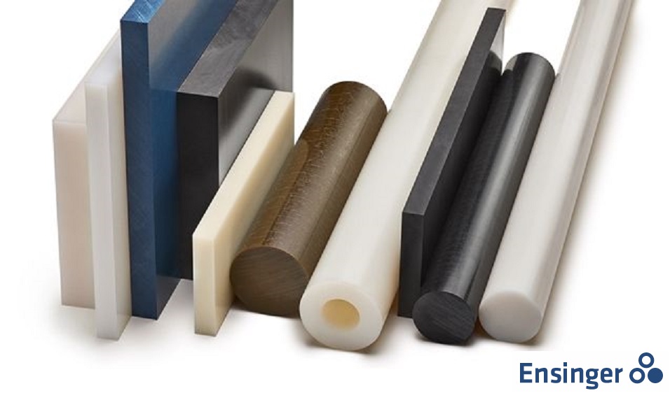 A stack of various plastic sheets and rods in different colors and thicknesses, leaning against a white background.