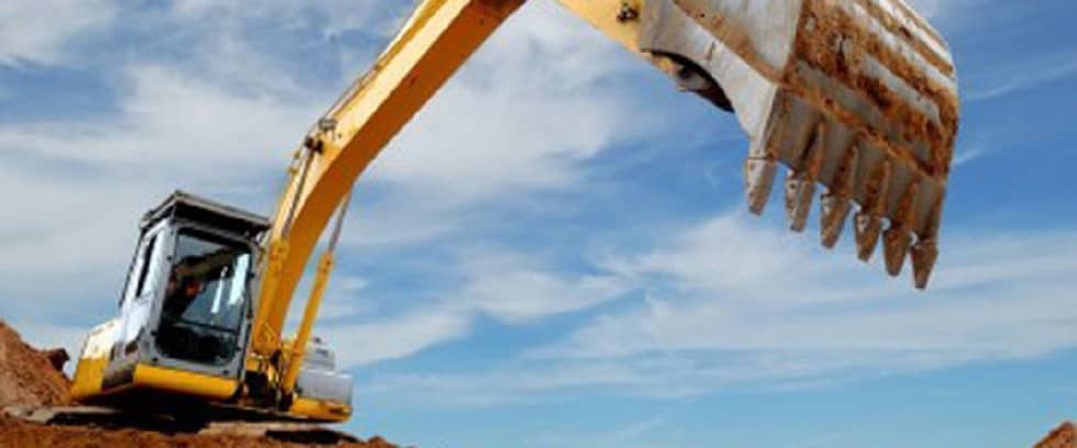 Excavator equipped with advanced motion transmission control through oil-hydraulics and pneumatic systems.