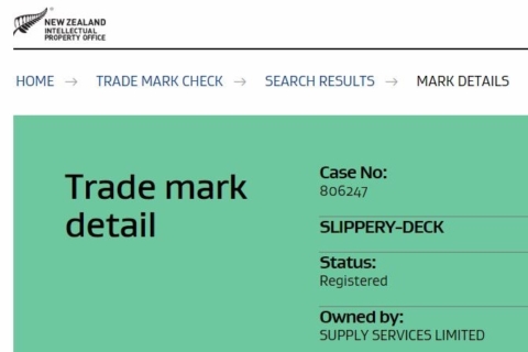 A close-up of of a trade mark detail for Supply Services and Slippery-Deck.