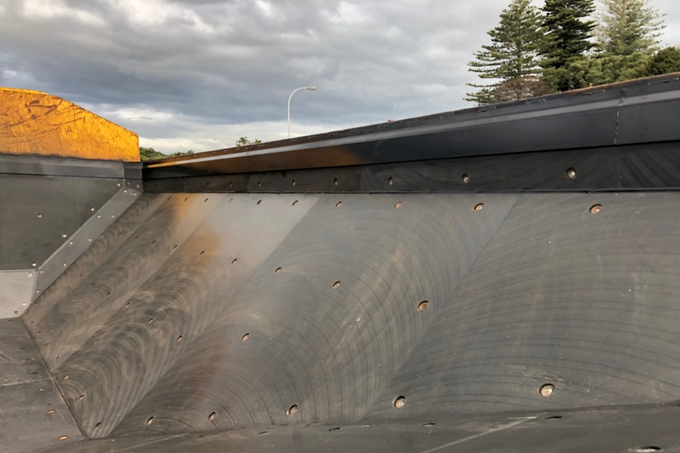 Close up of a truck fitted with a Slippery Deck Plastic Truck Body Liner.