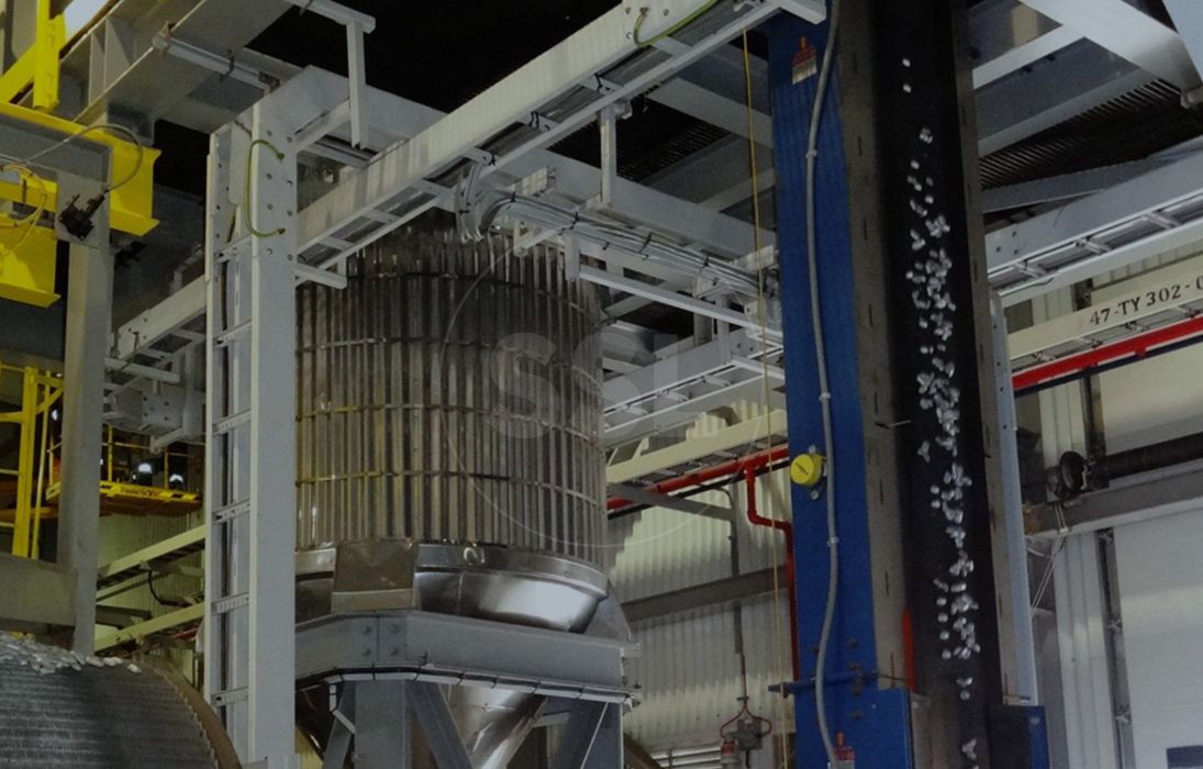 A vertical magnetic conveyor by Supply Services is in use.