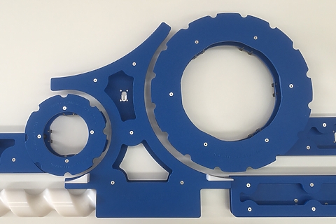 Reverse engineered food-grade change-parts in blue engineering plastics.