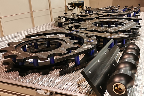 Change parts are laid out on a table for inspection.